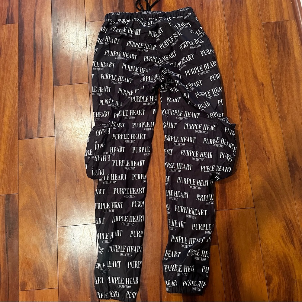 Purple Heart all over print track pants unisex